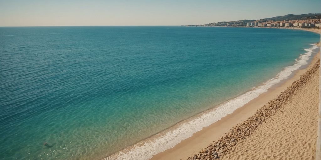 Beautiful Spanish beach with golden sand and blue water