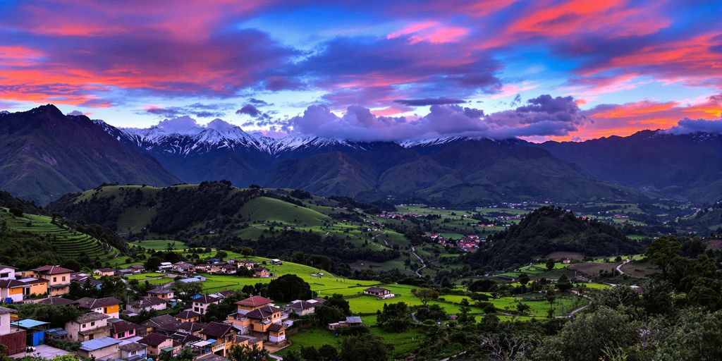 Stunning Peruvian landscape with mountains and village at sunset.